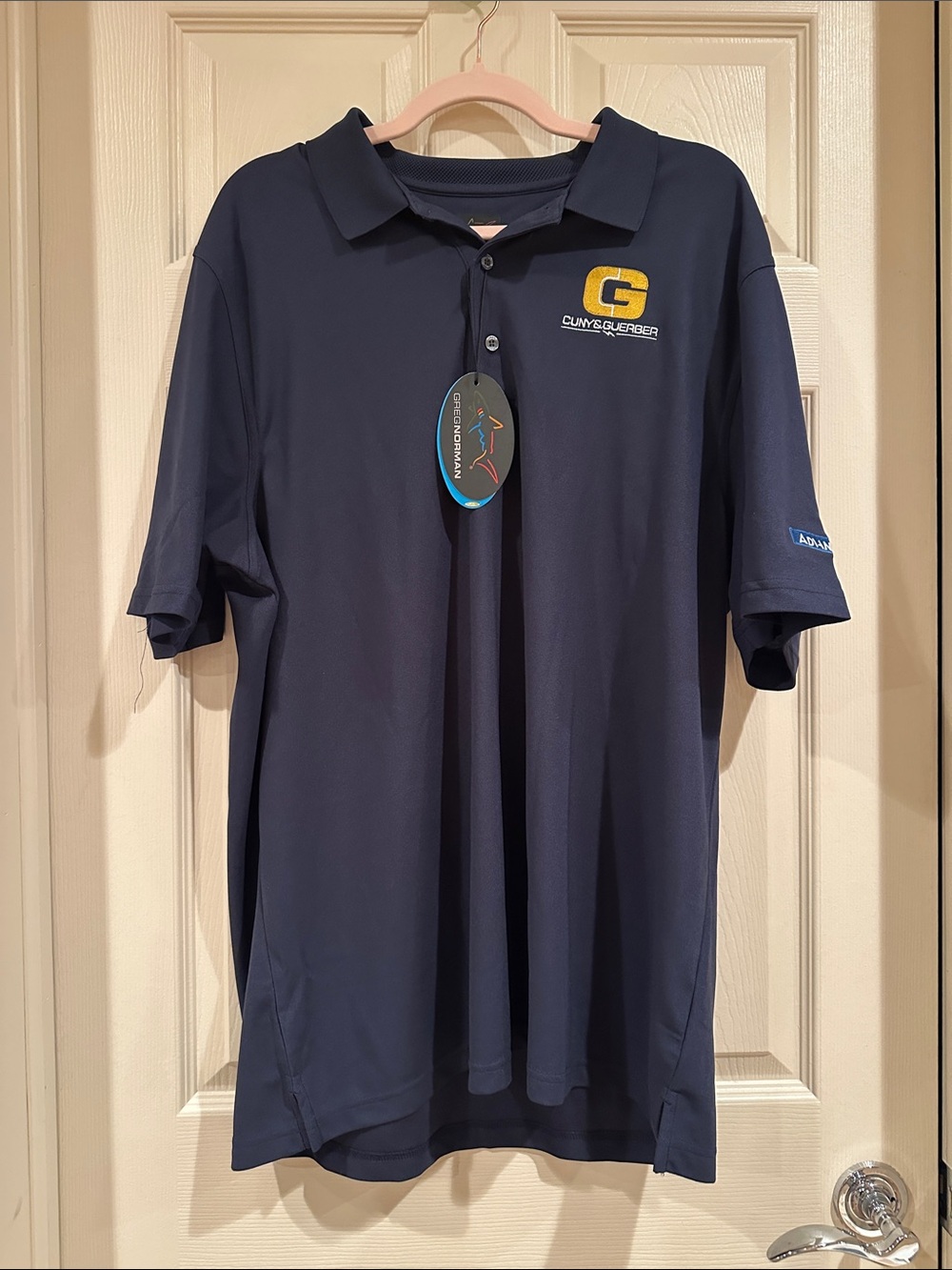 Greg Norman Collection Navy Polo with Yellow Logo